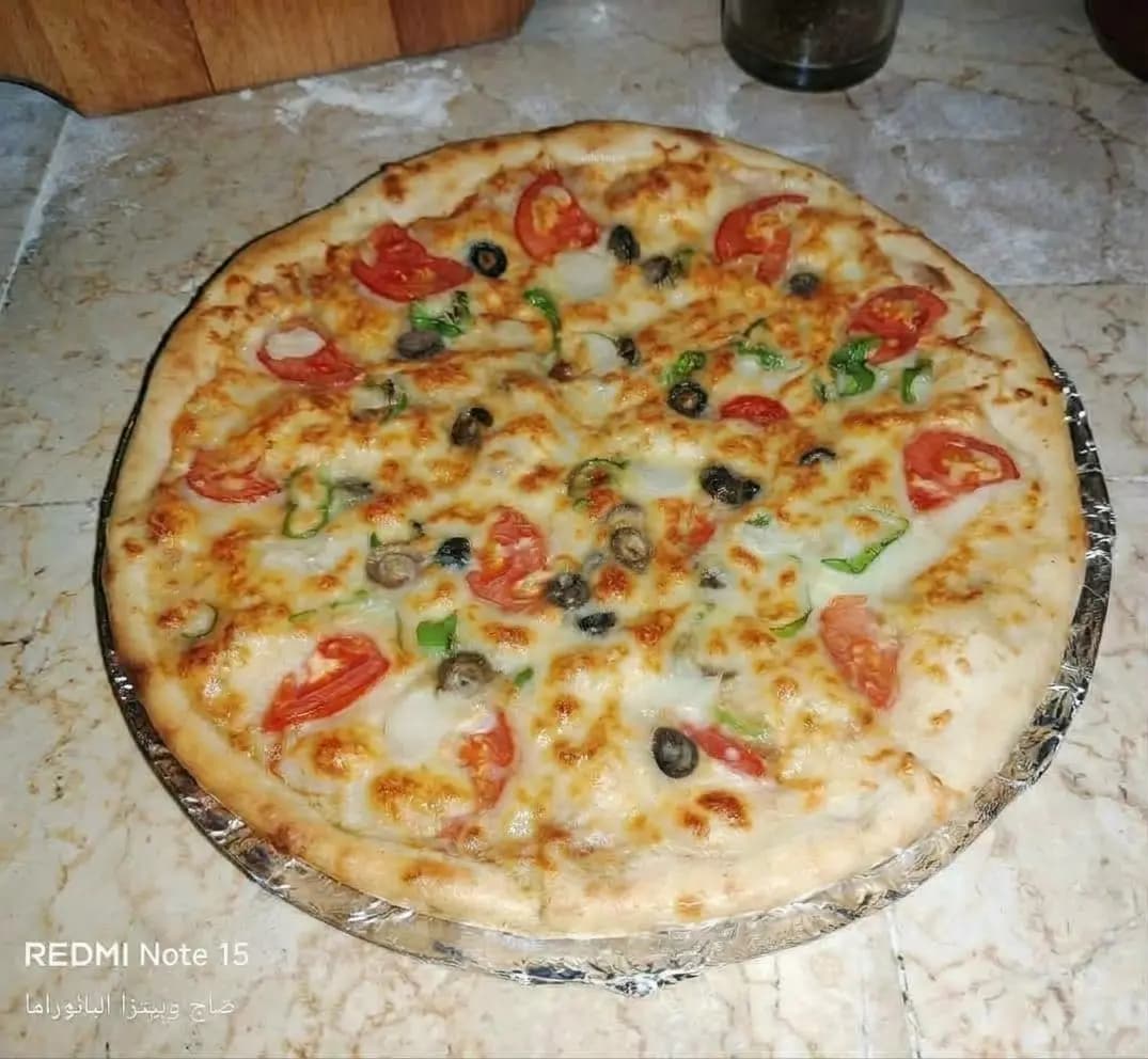 بيتزا وسط - صورة 1